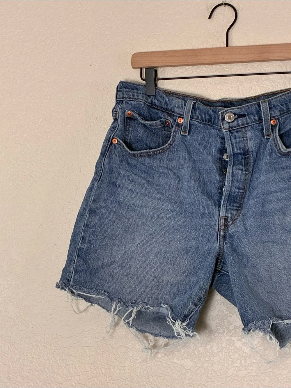 Levi’s | 501 button fly raw hem cut off long jean shorts bermuda denim size 32